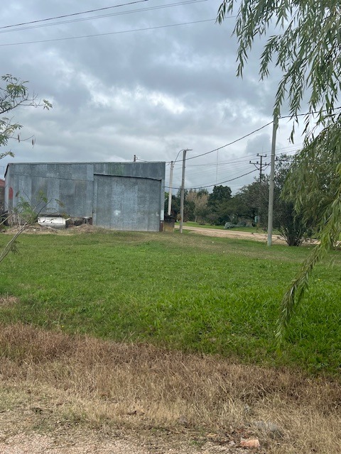 50% indiviso de solar con construcciones en San Ramón, Canelones